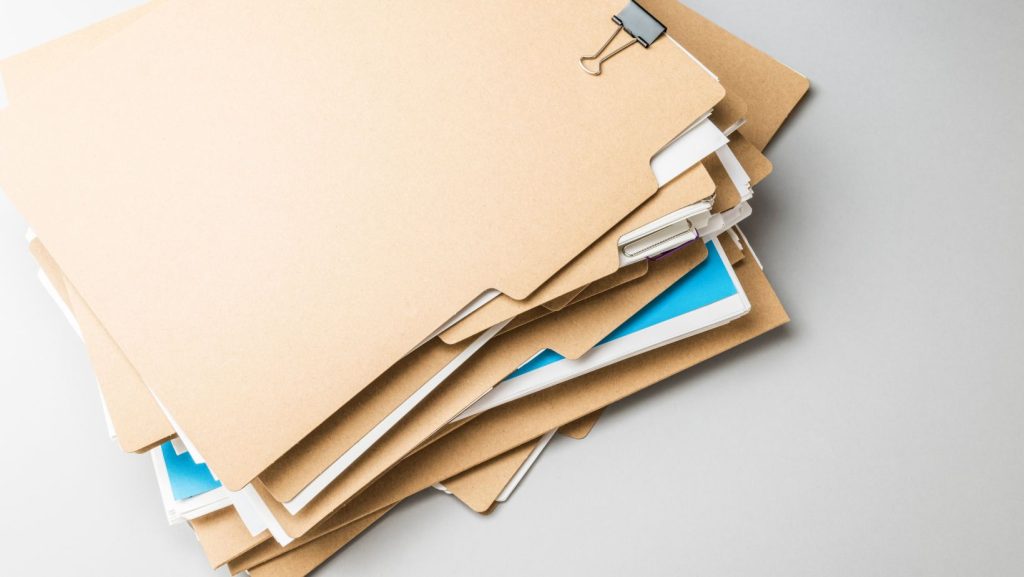 a pile of files ready for a one-time shredding service